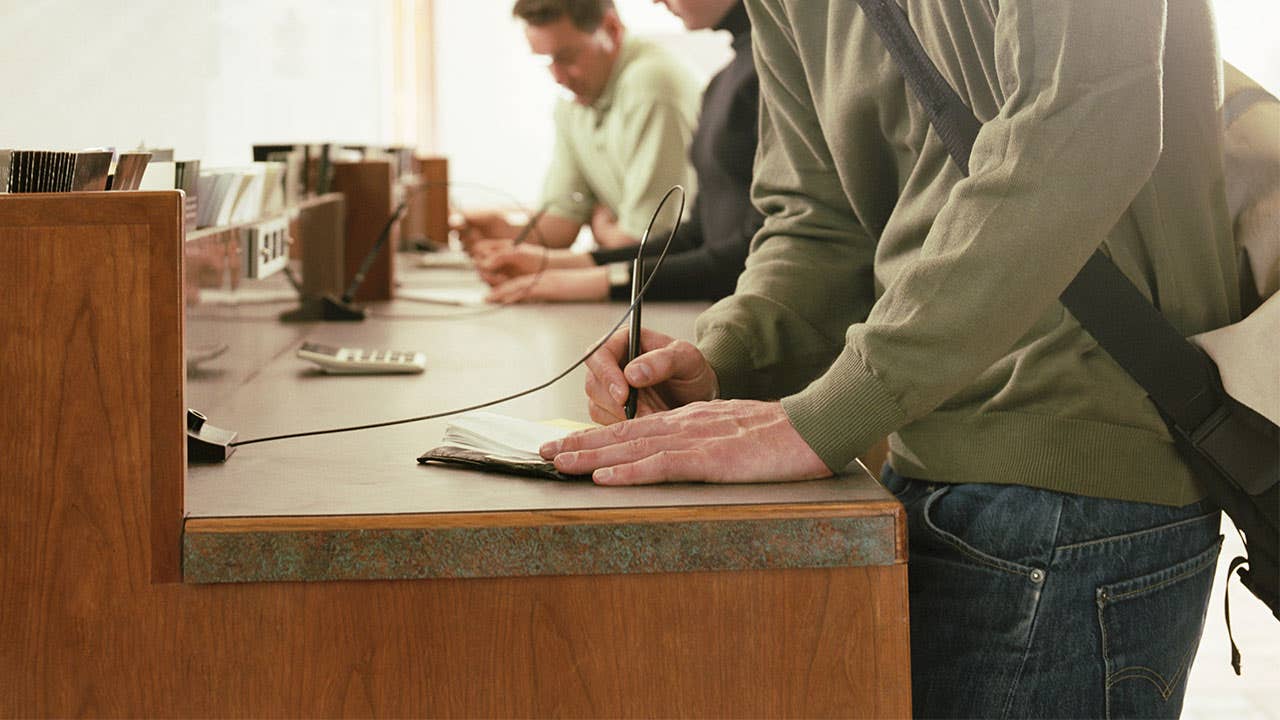 Man filling out money order