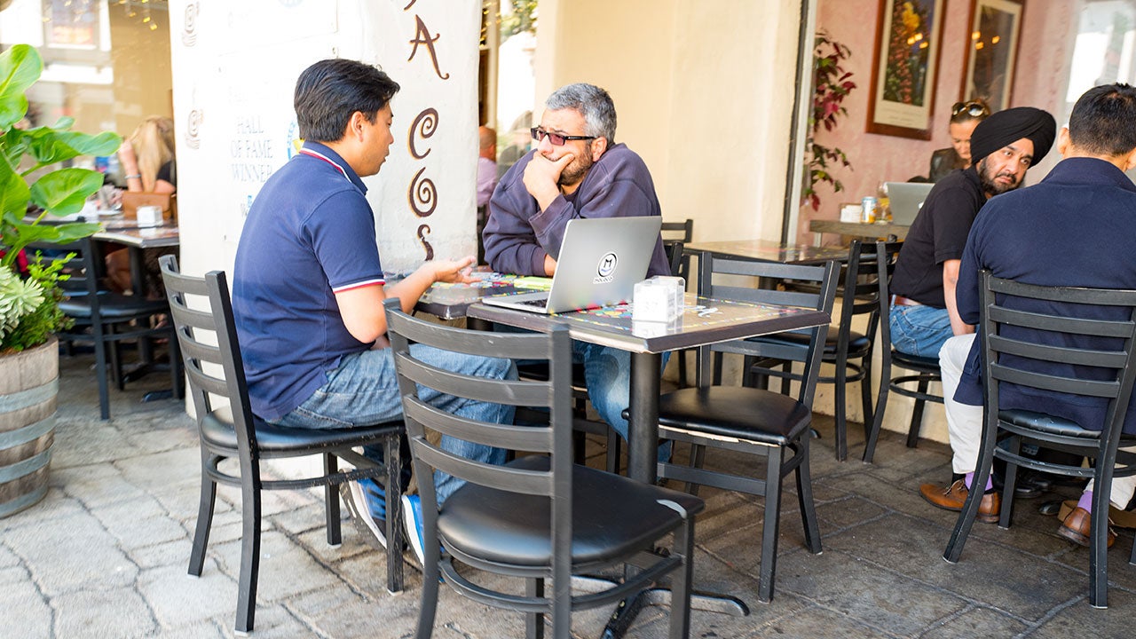 Parent and adult child in cafe