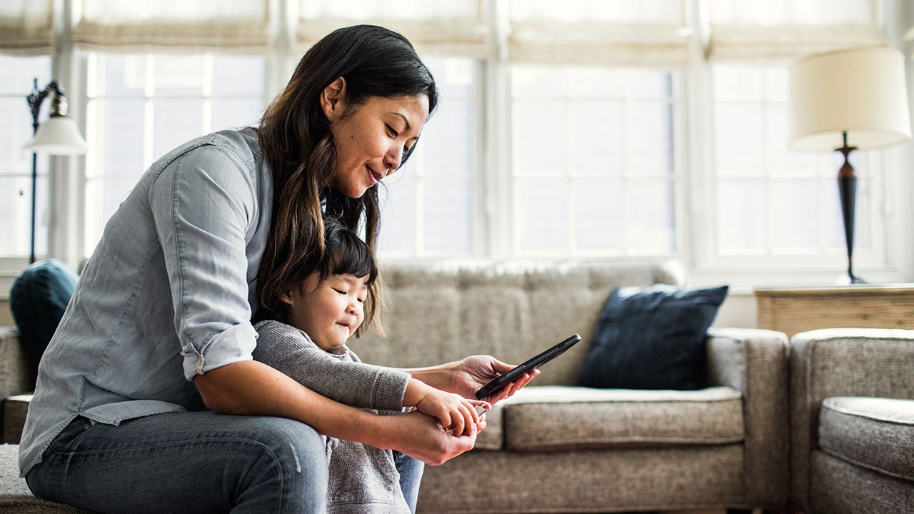 Mother and baby looking at phone