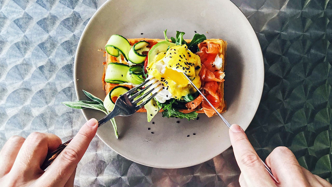 Woman eating gourmet toast