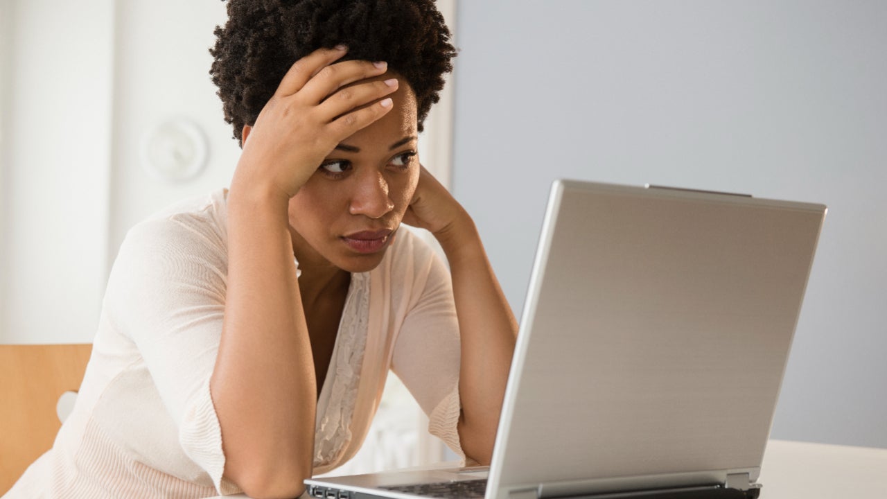 distressed woman with laptop