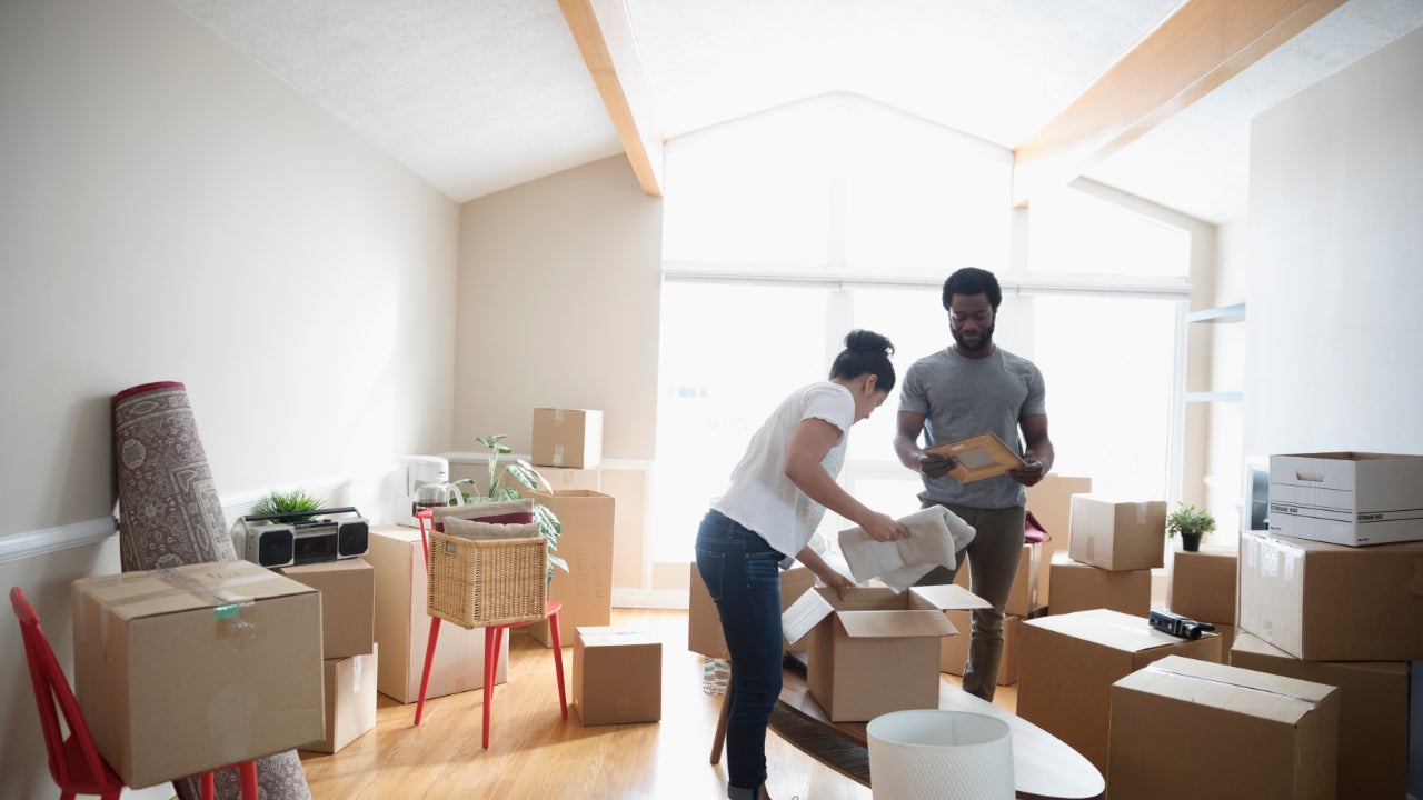 a couple unpacking boxes