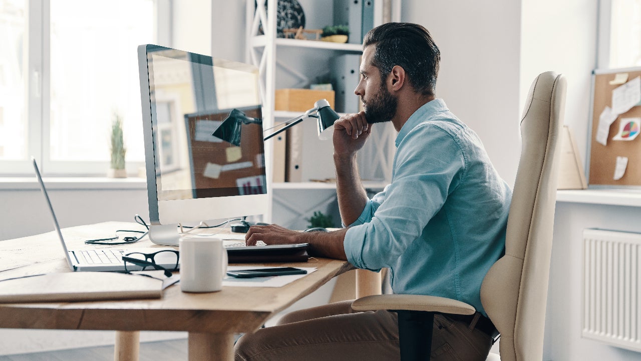 man at computer in home office