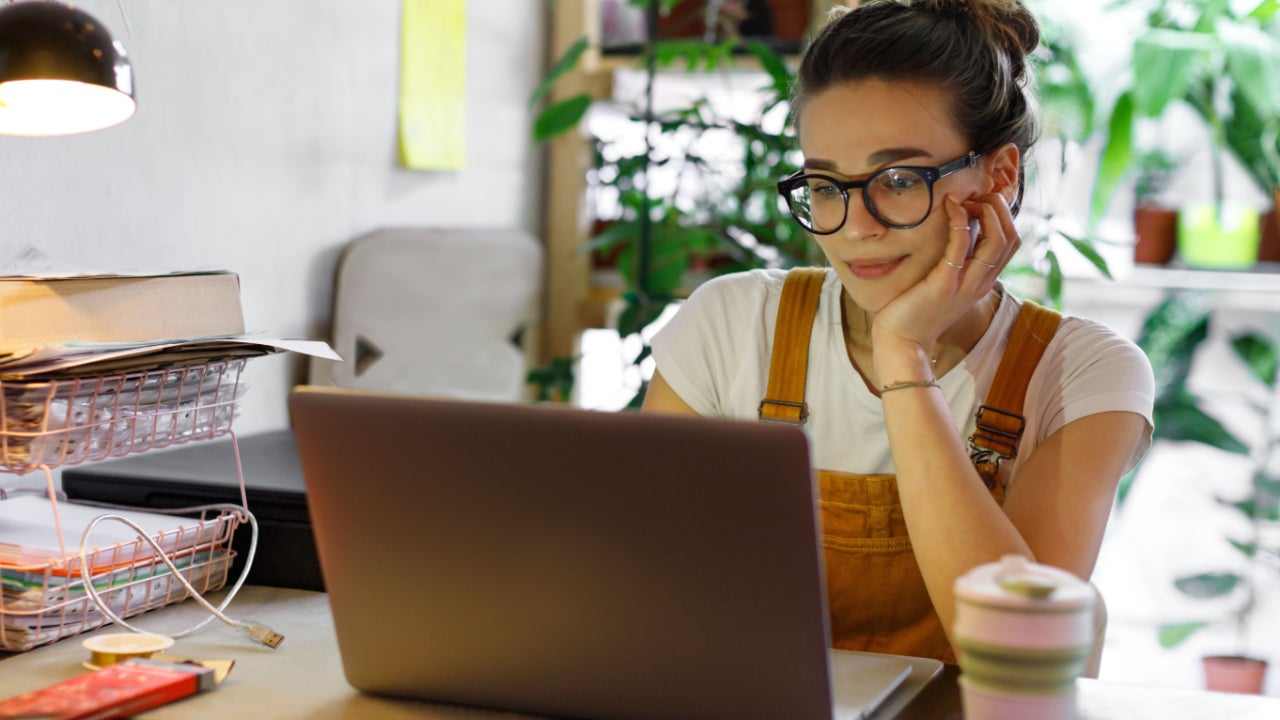 young woman at home using computer