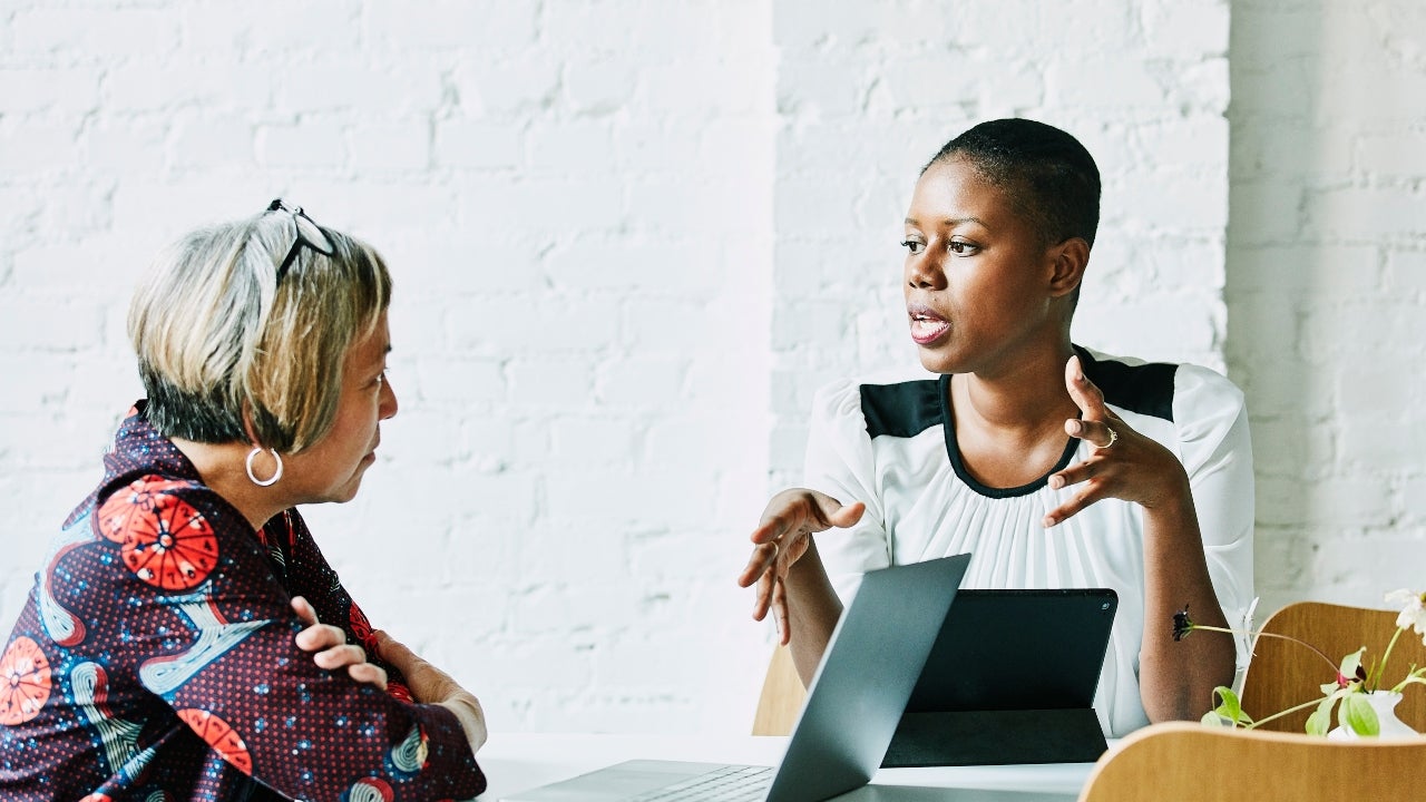 A mortgage loan officer meets with a borrower.