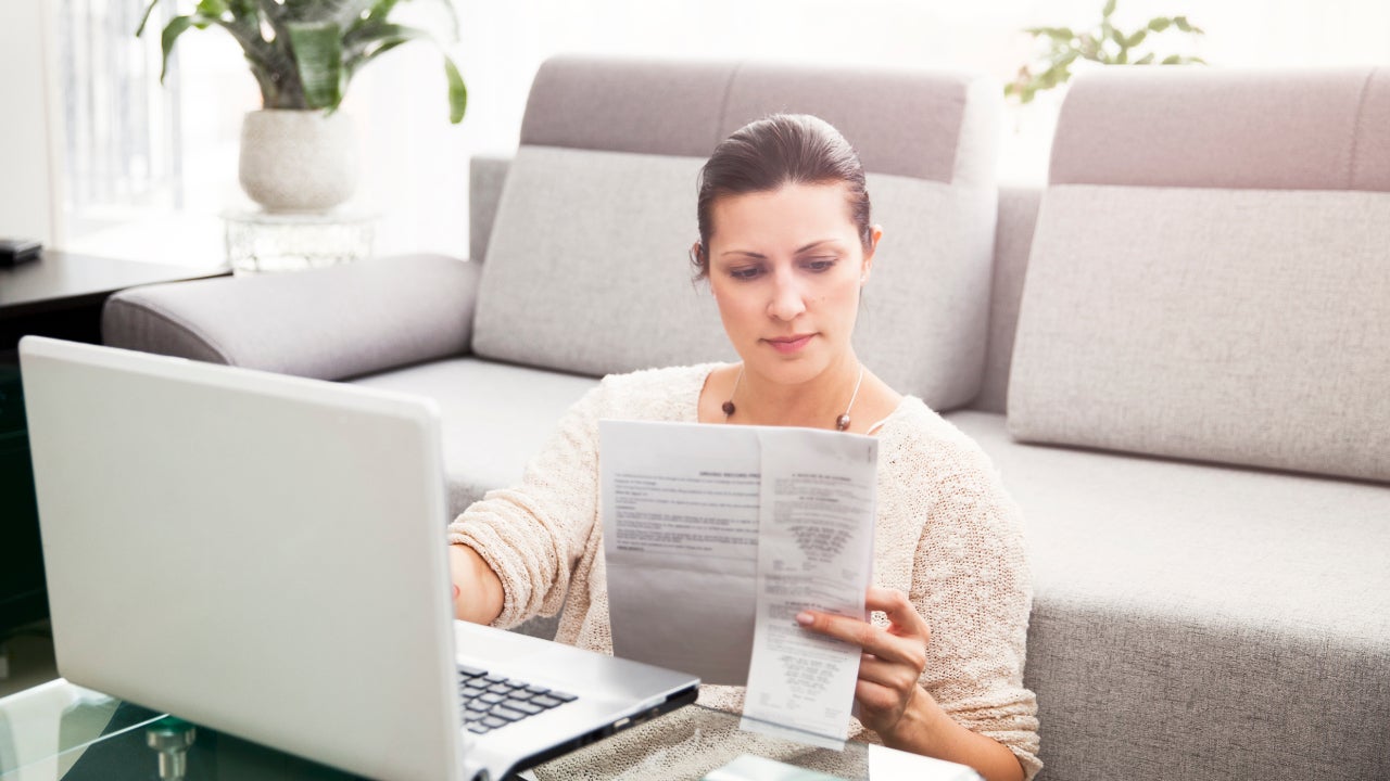 Woman in her 30s filling out tax information online