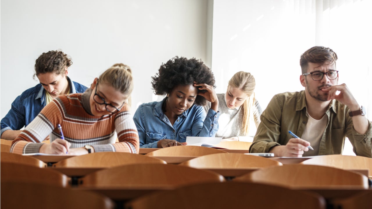 Students take notes in a college classroom