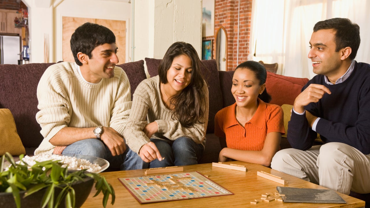 family playing board game