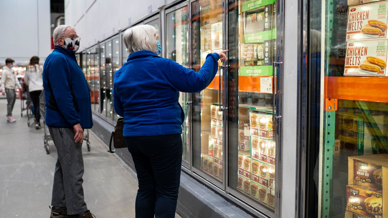 Shoppers in a Costco looking for items