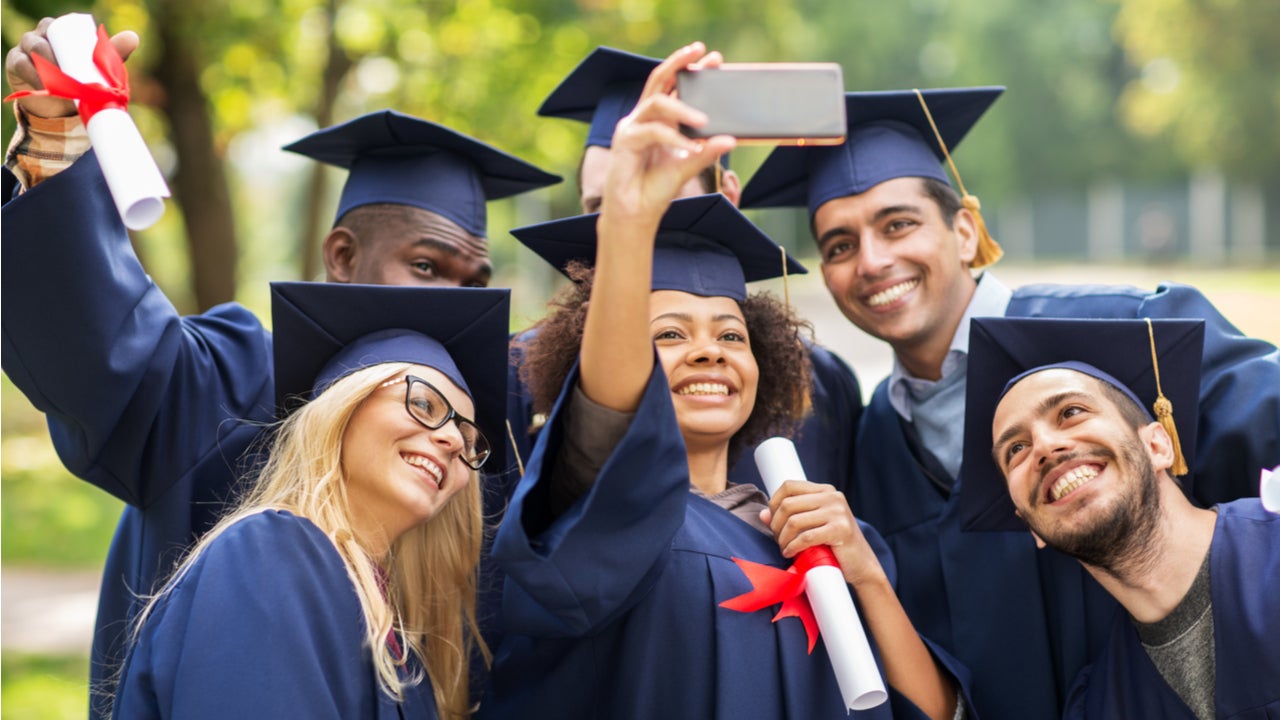 College graduates take a photo together