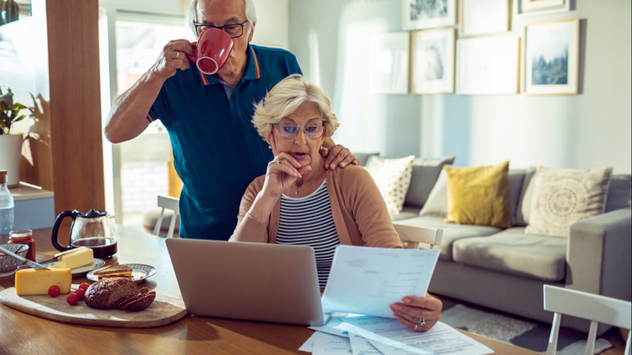 Senior couple reviewing credit card statements