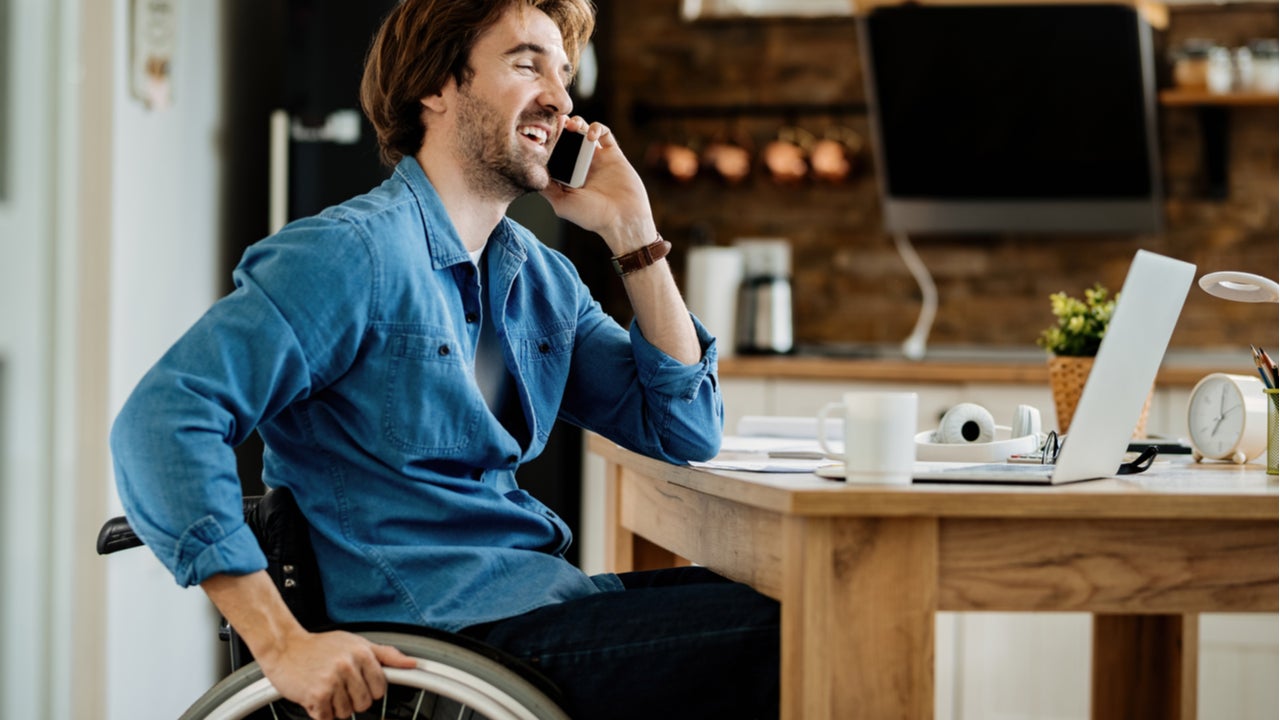 Young man working from home in a wheelchair