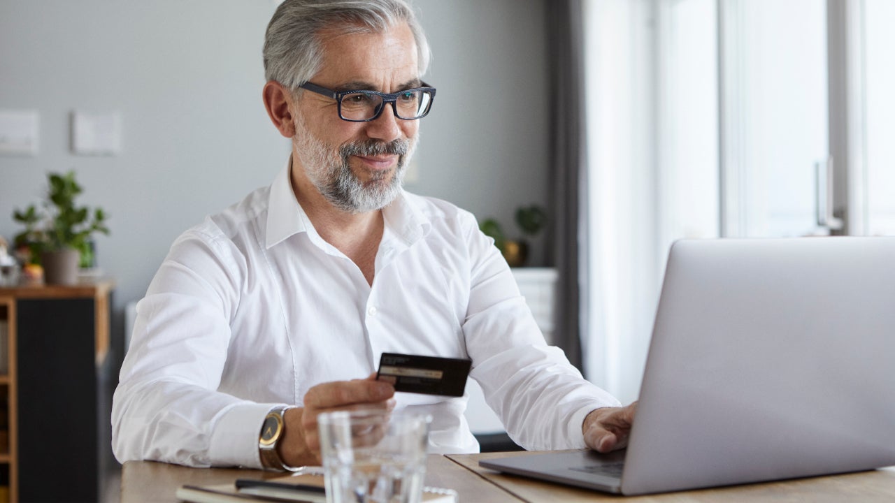 Business person holding credit card