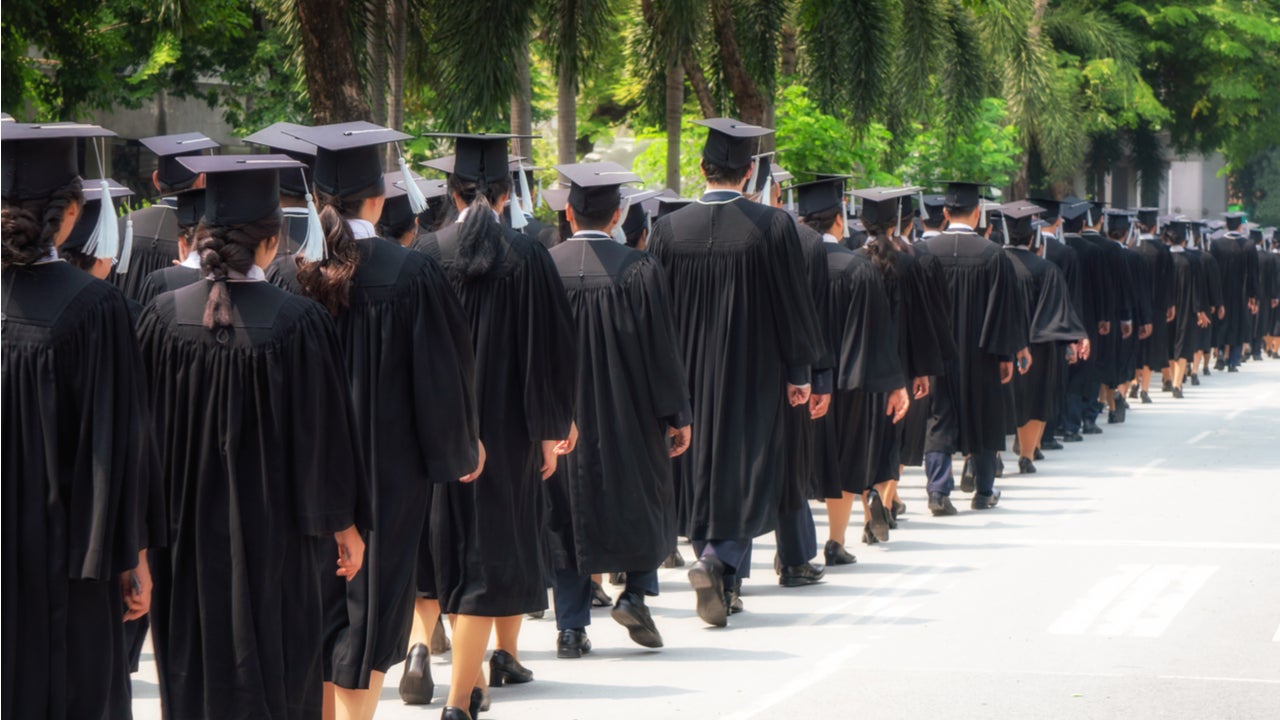 Students line up at a college graduation ceremony