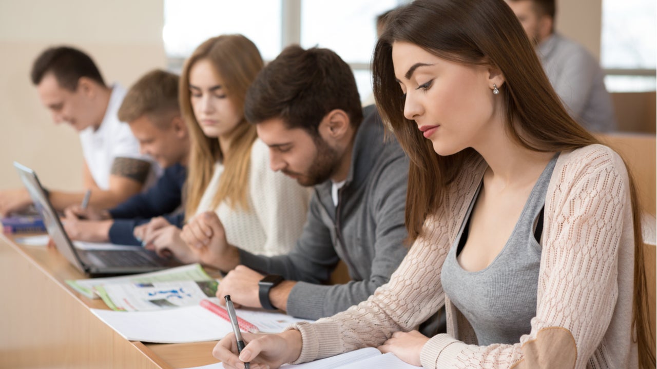 Students work on assignments in college classroom