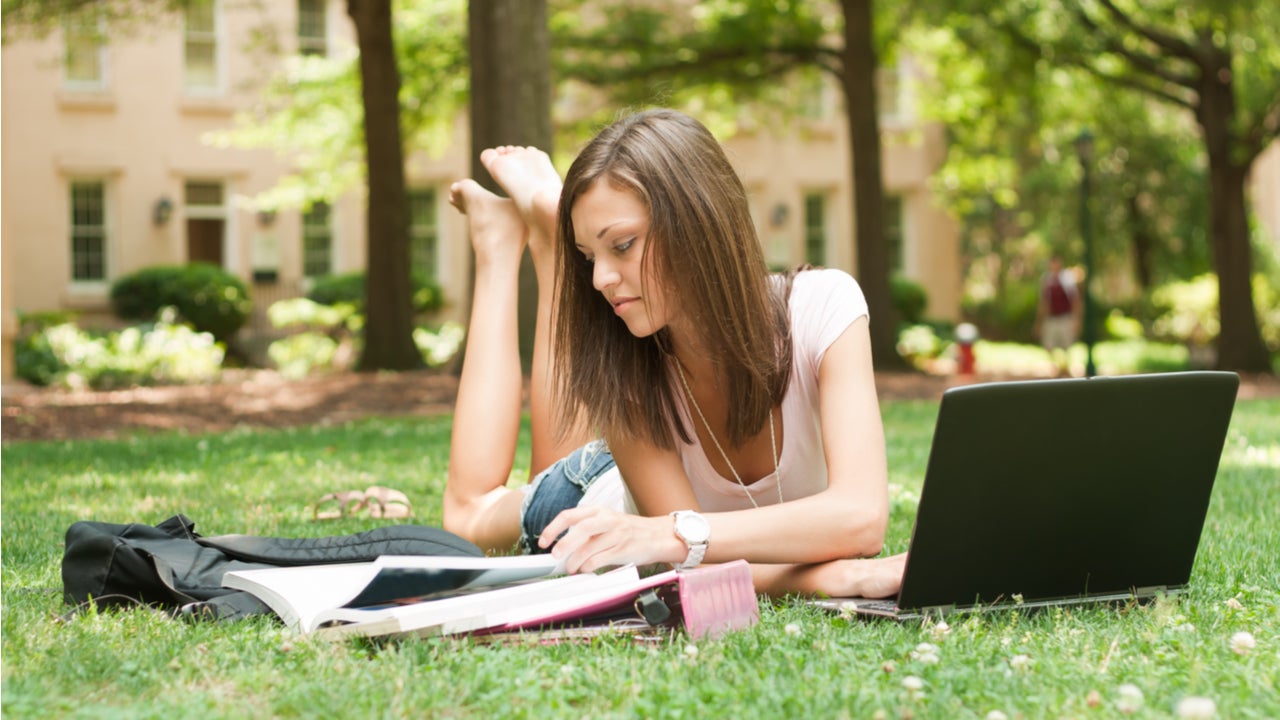 College student studies outside