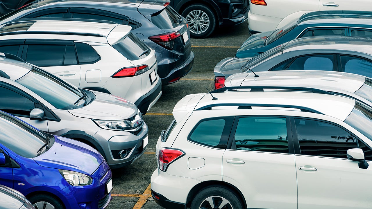 Car parked at parking lot of the airport for rental. Aerial view of car parking lot of the airport. Used luxury car for sale and rental service. Automobile parking space. Car dealership concept.