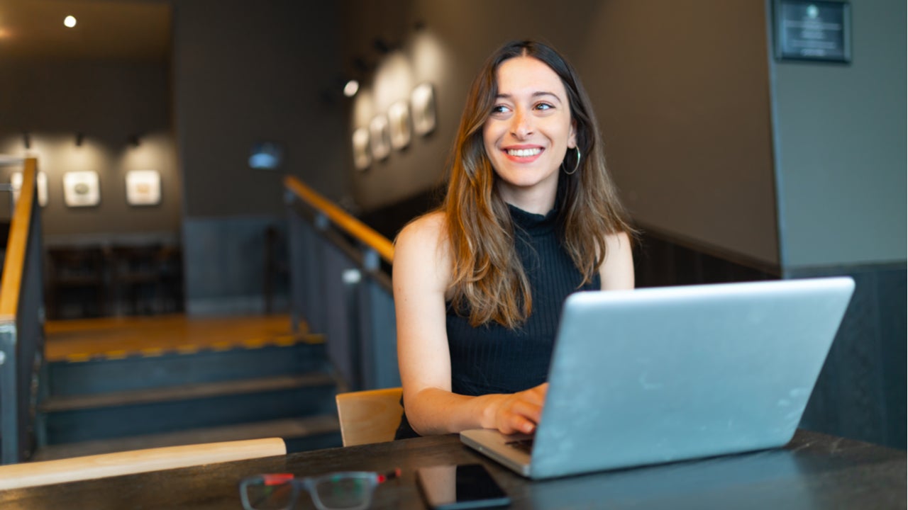 Young business student works on a laptop