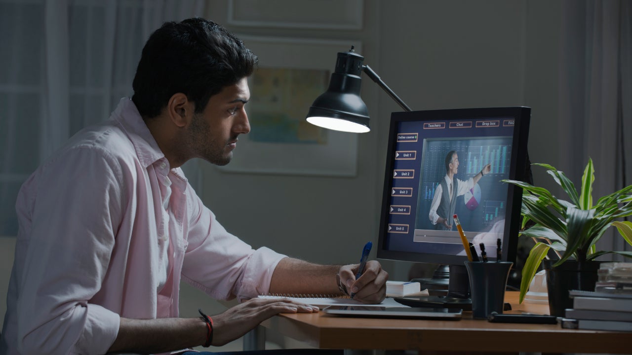 Man working hard at computer desk