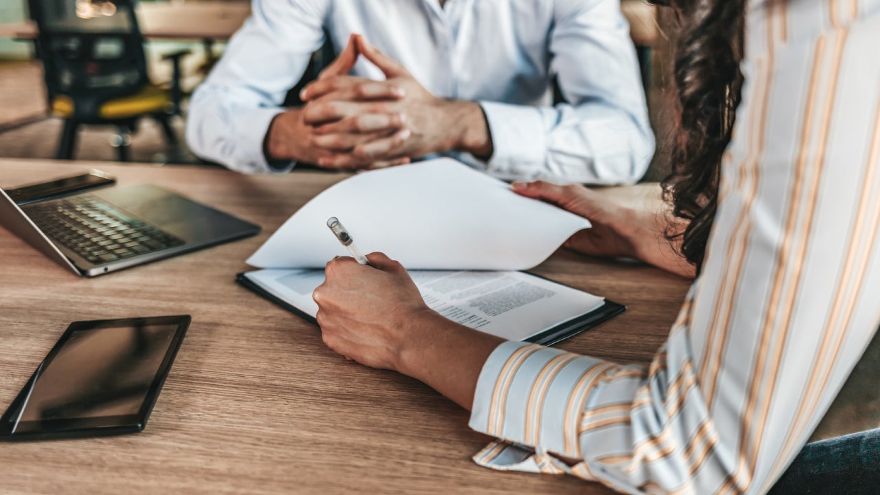 Business people negotiating a contract