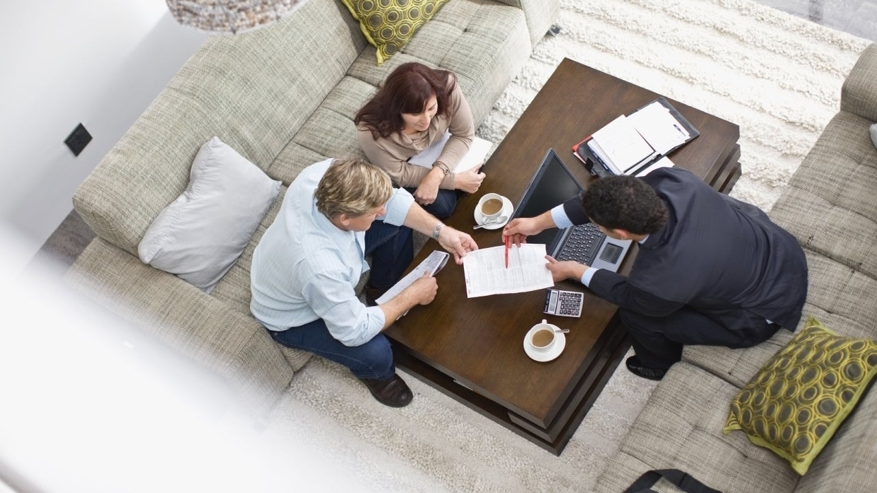 Businessman talking with couple