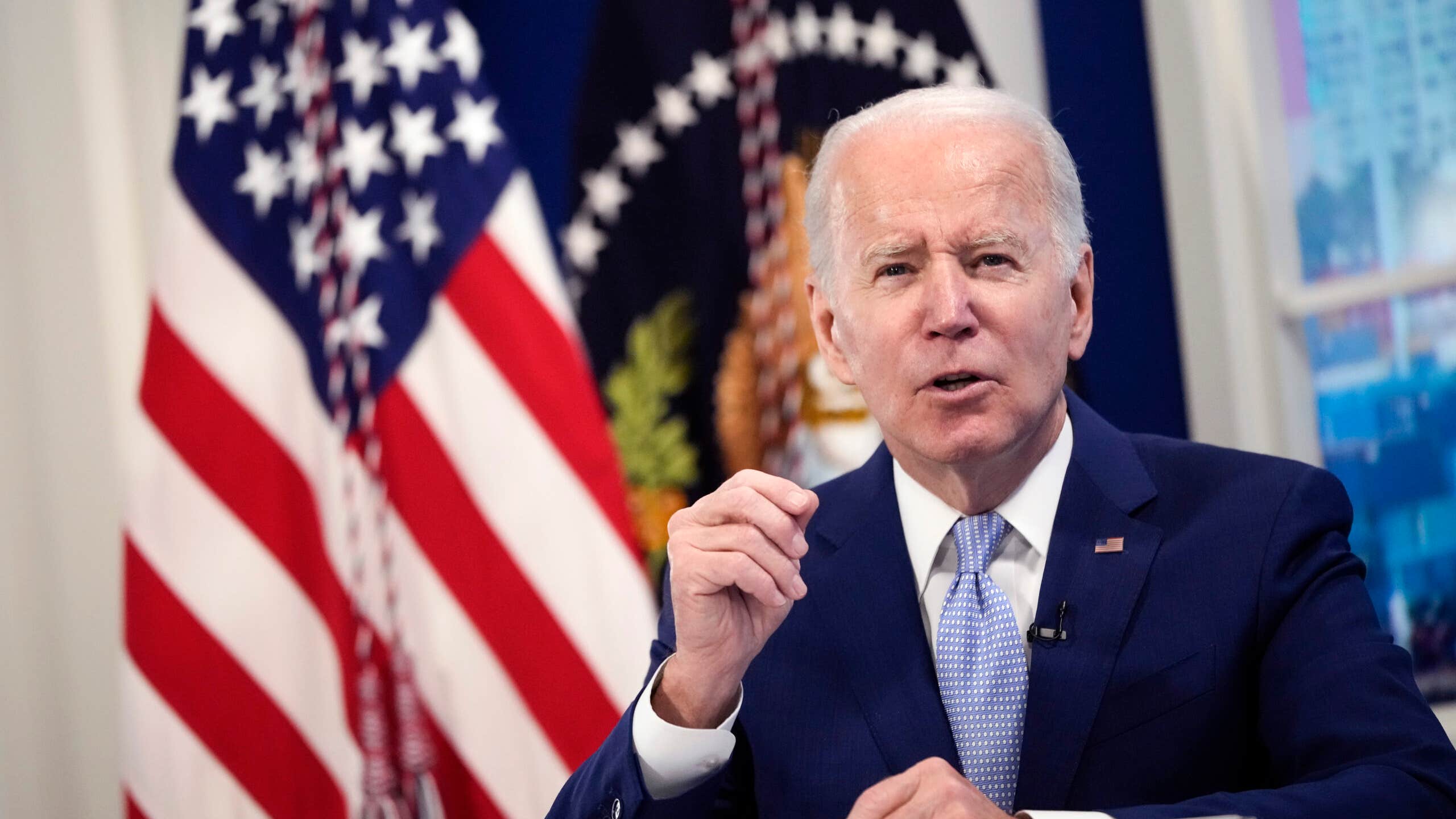 Biden stands at a podium.