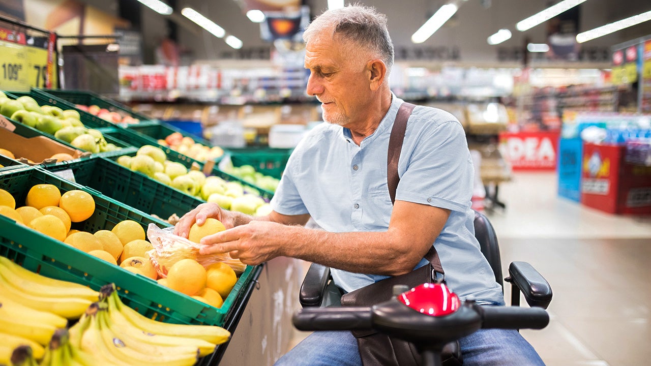 Senior man with a disability in shopping