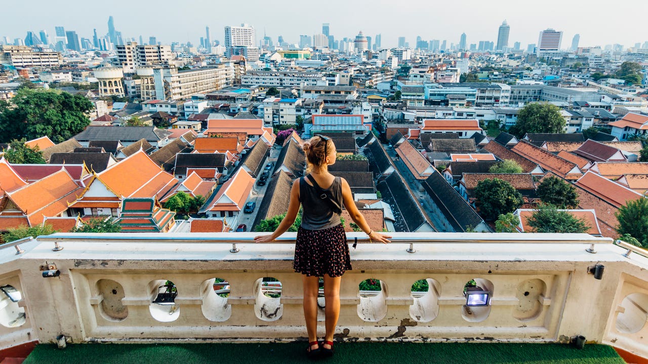 woman looking out at view of city