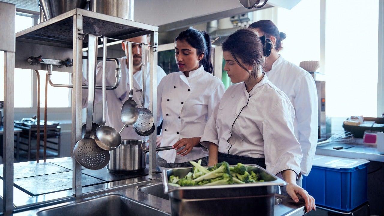 Chef explains recipe in a commercial kitchen