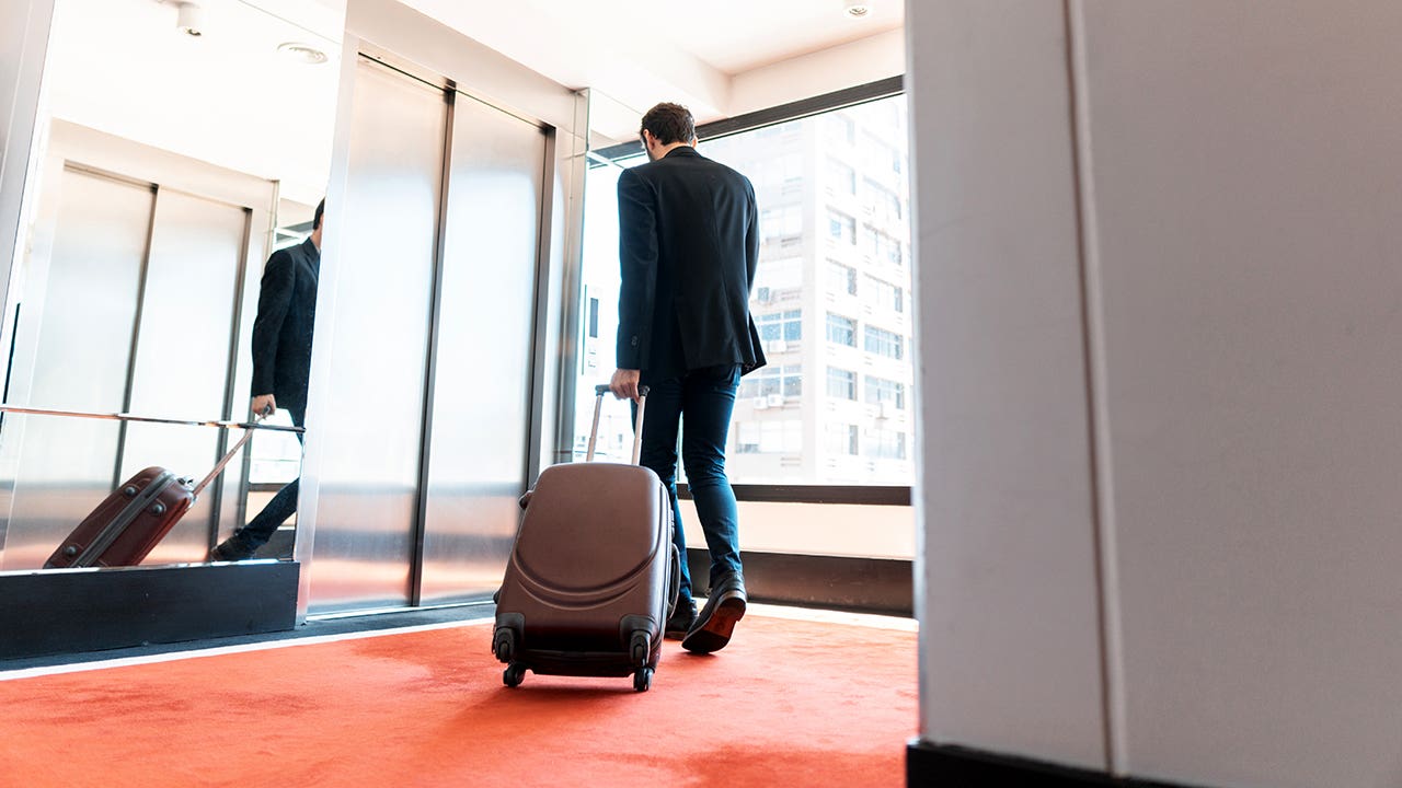 businessman leaving a hotel