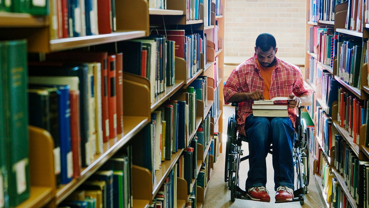 college student who uses a wheelchair in the library