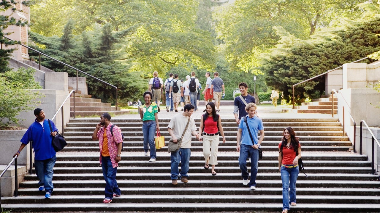 College students walk down stairs on campus