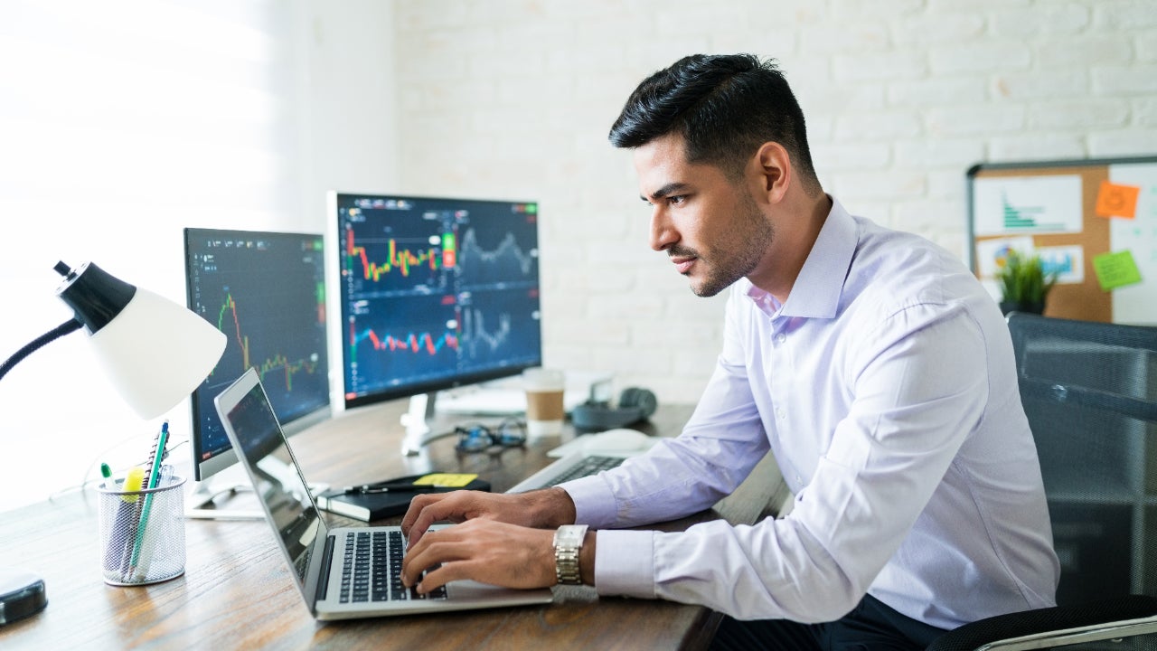 Man trading on computer