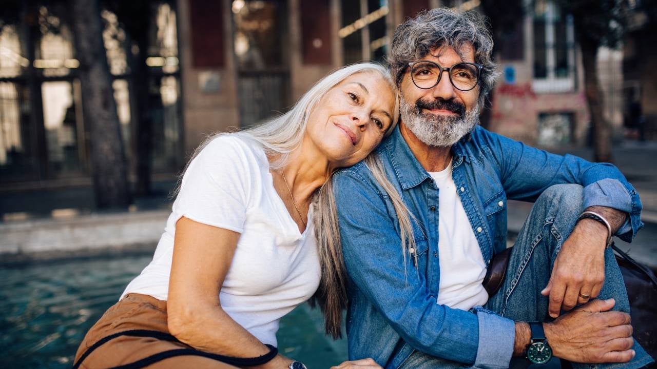 Portrait of a happy mature couple enjoying their romantic vacation in Barcelona