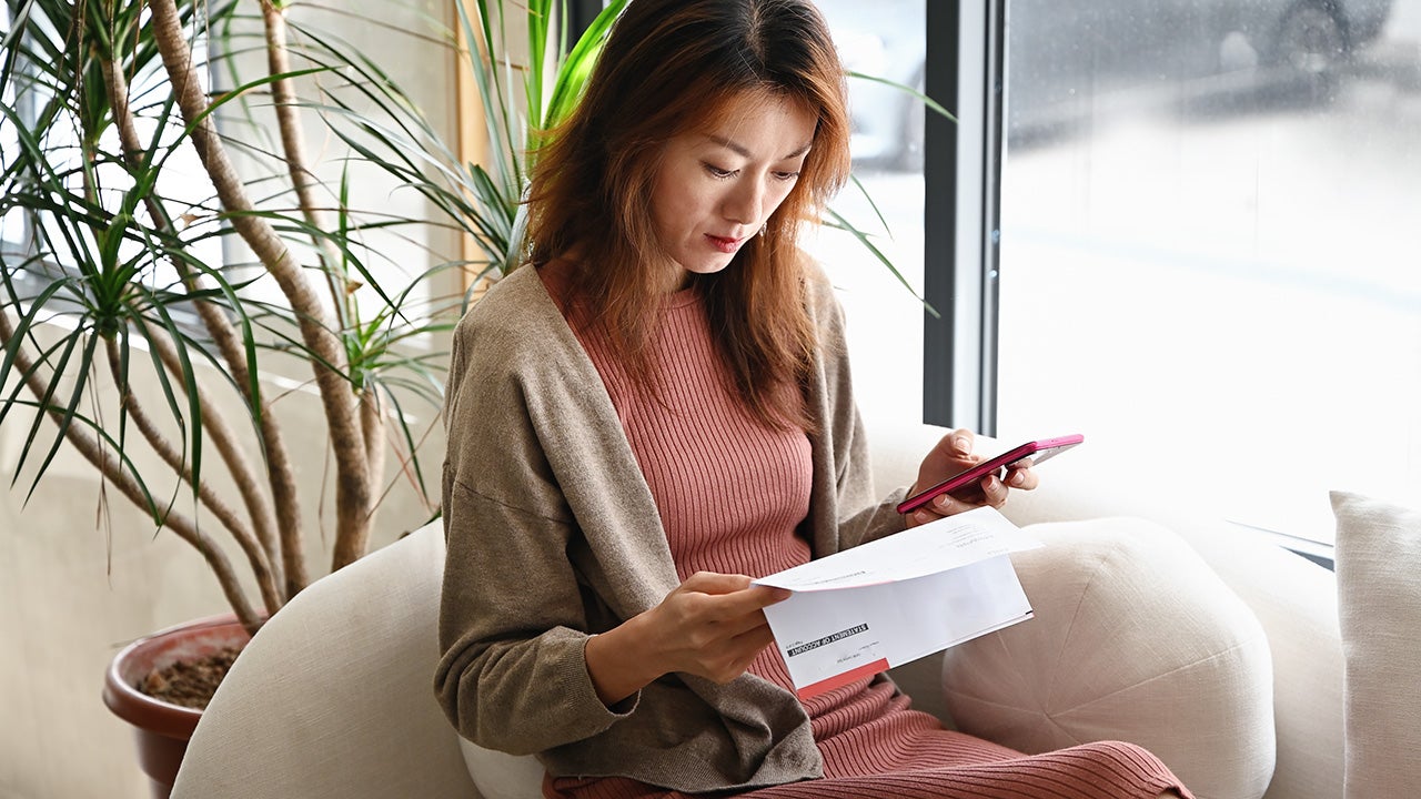 woman looking at paperwork