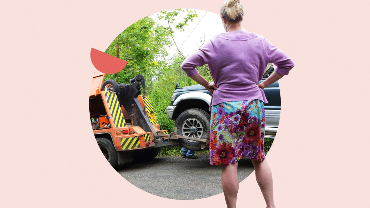 White woman facing away from camera, car getting toed in front of her. The image is framed in light pink and there is a red half-circle design on the left.