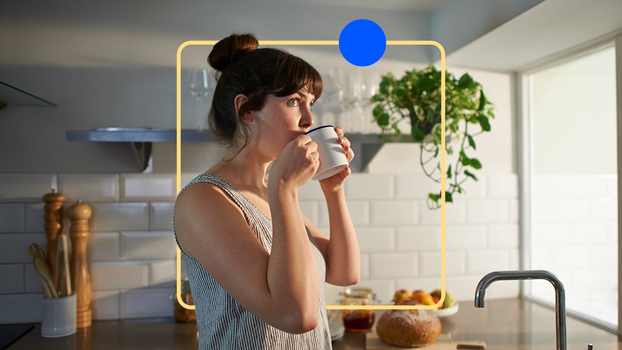 A homeowner drinking a cup of coffee.