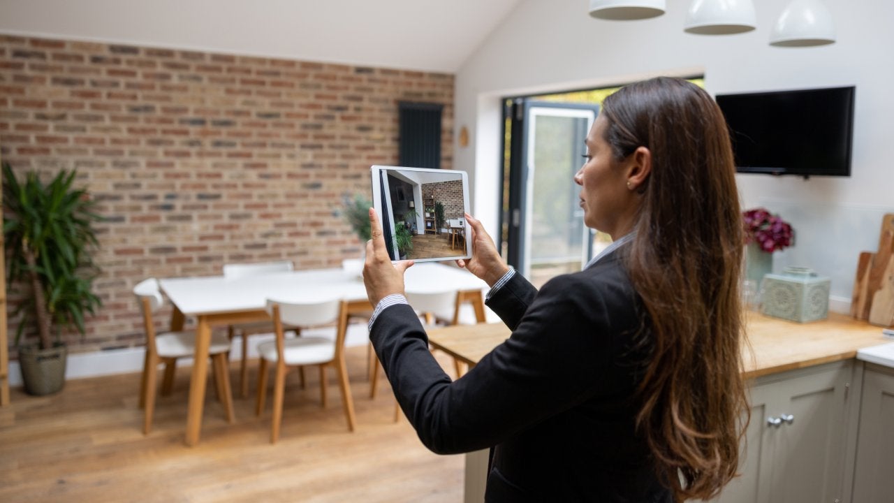 Real estate agent doing a virtual showing of a property using a tablet computer