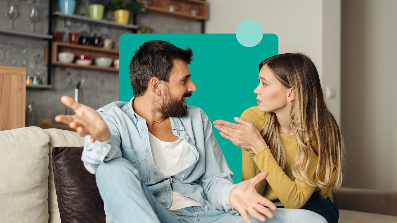 a caucasian couple sitting on the couch and having a conversation