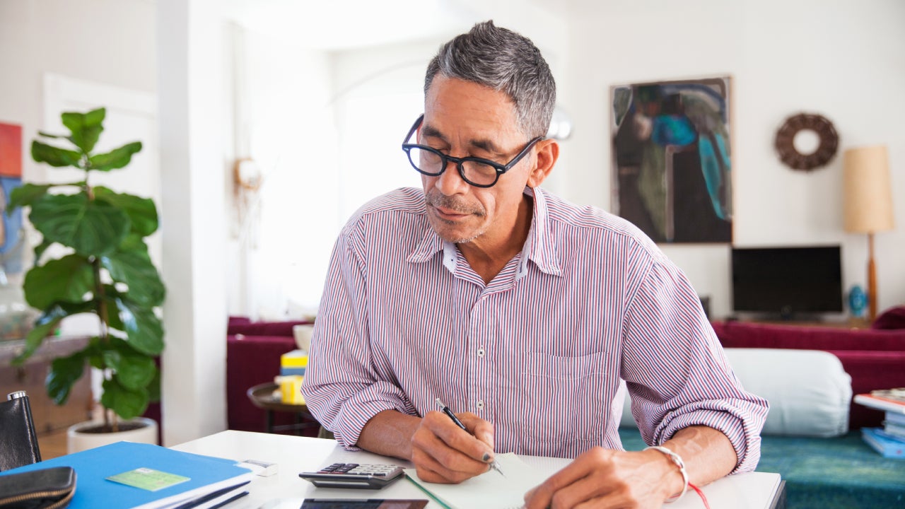 Man writing something at a desk