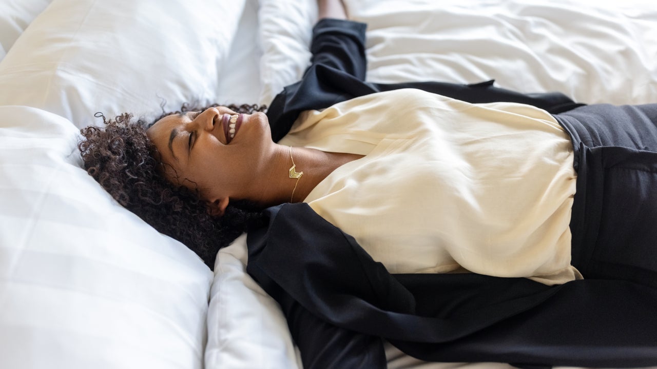 woman laying down on a bed