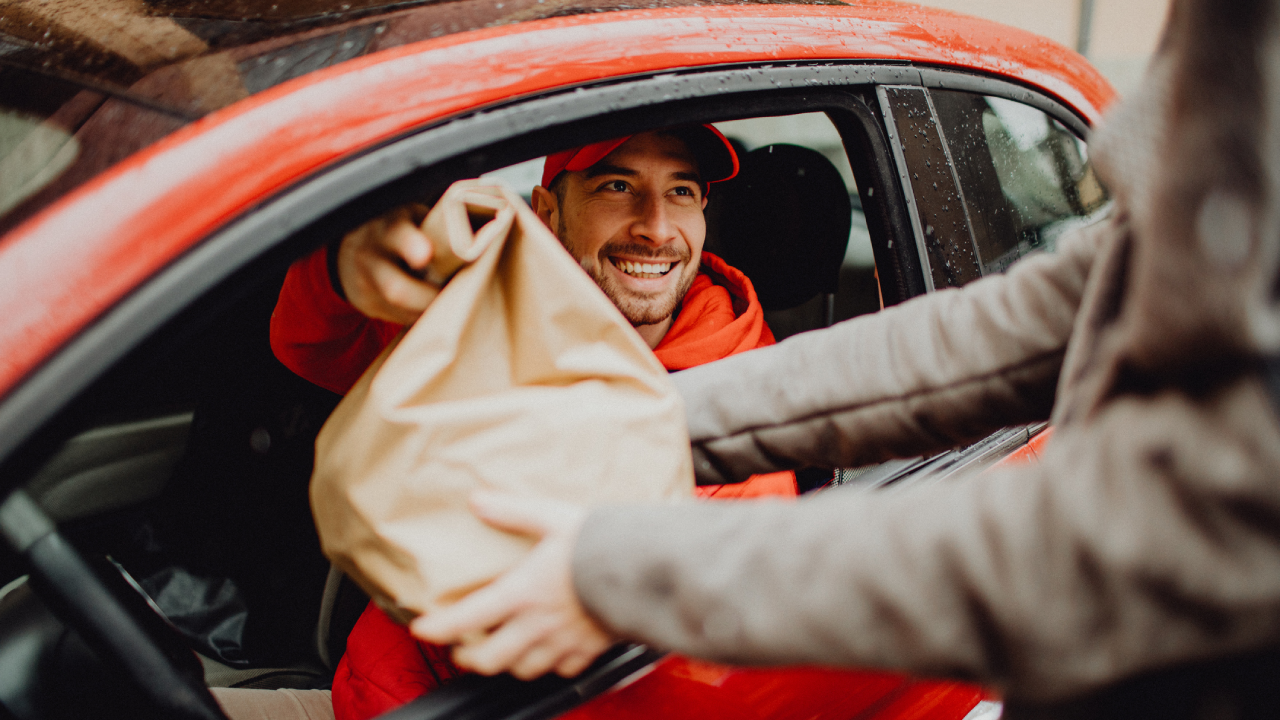 Person delivering food to a customer.