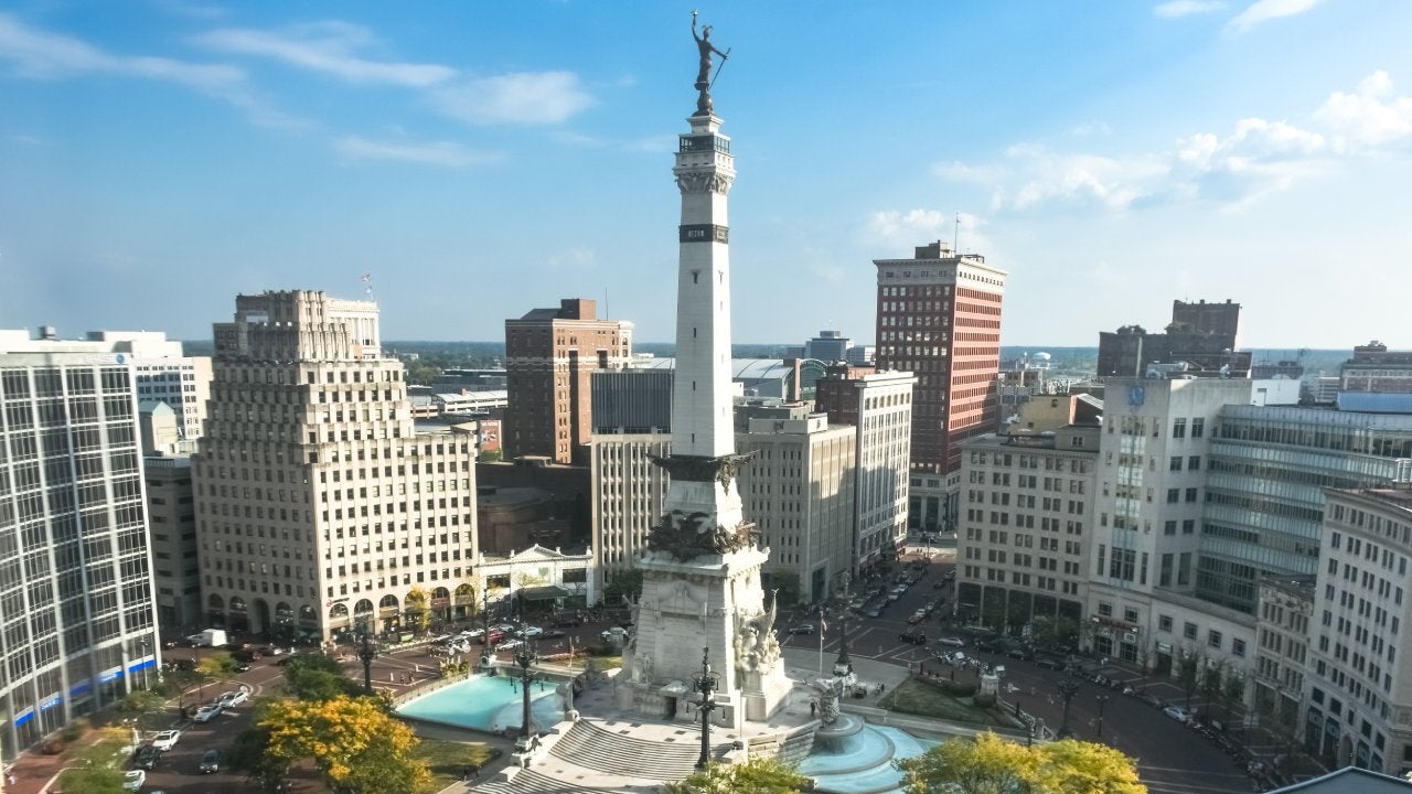 Rush hour right after sunrise over Indiana's Soldiers and Sailors Monument on Monument Circle, Indianapolis