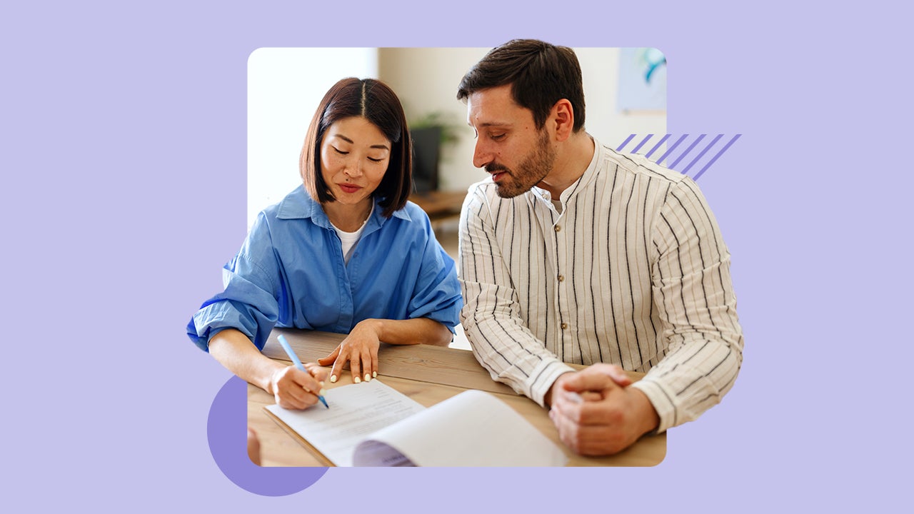 Two people reviewing documents