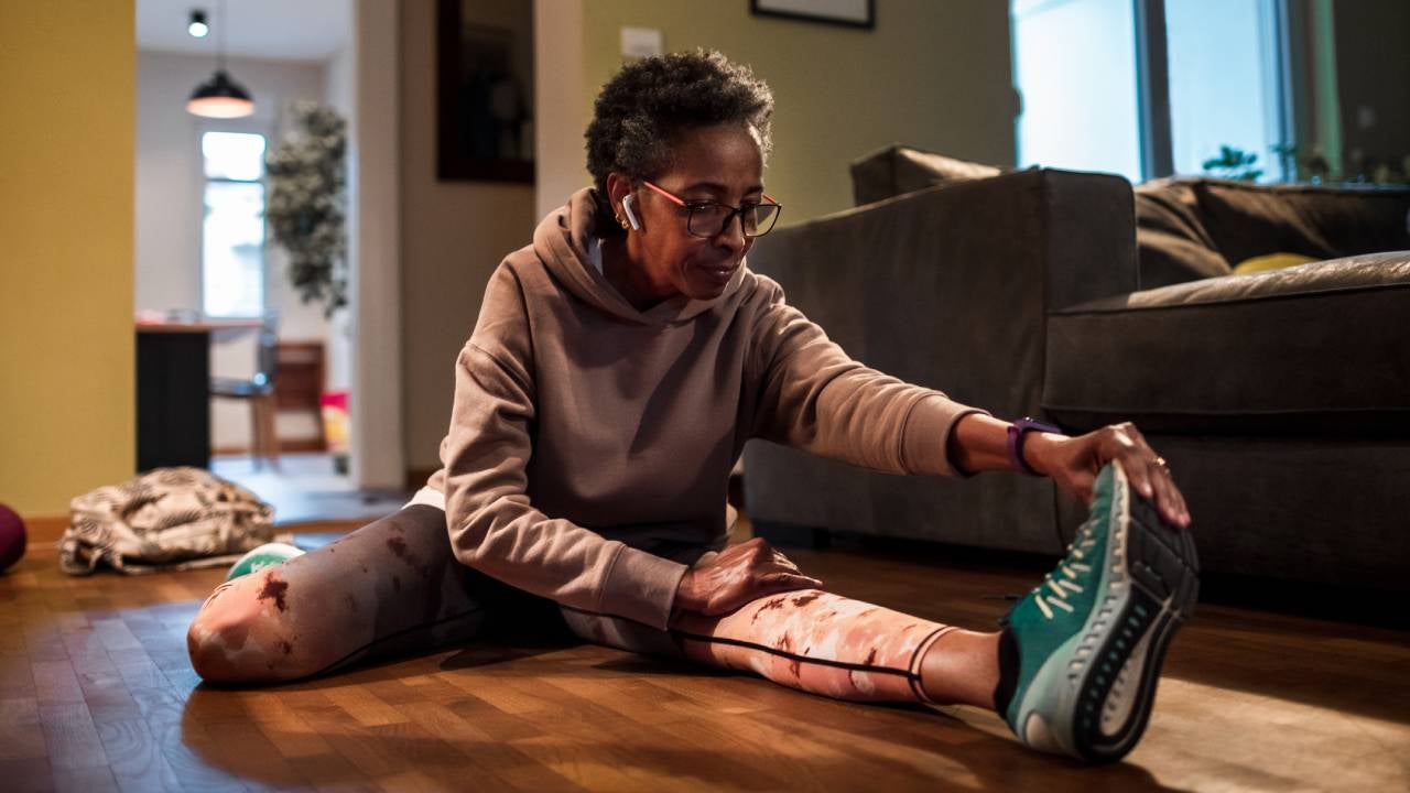 Senior woman exercising at home