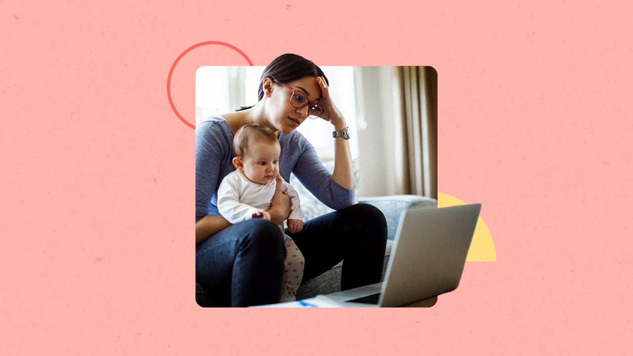 Distressed woman holding a baby looking for jobs on a laptop