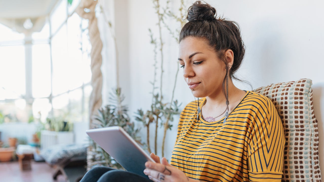 freelancer using digital tablet