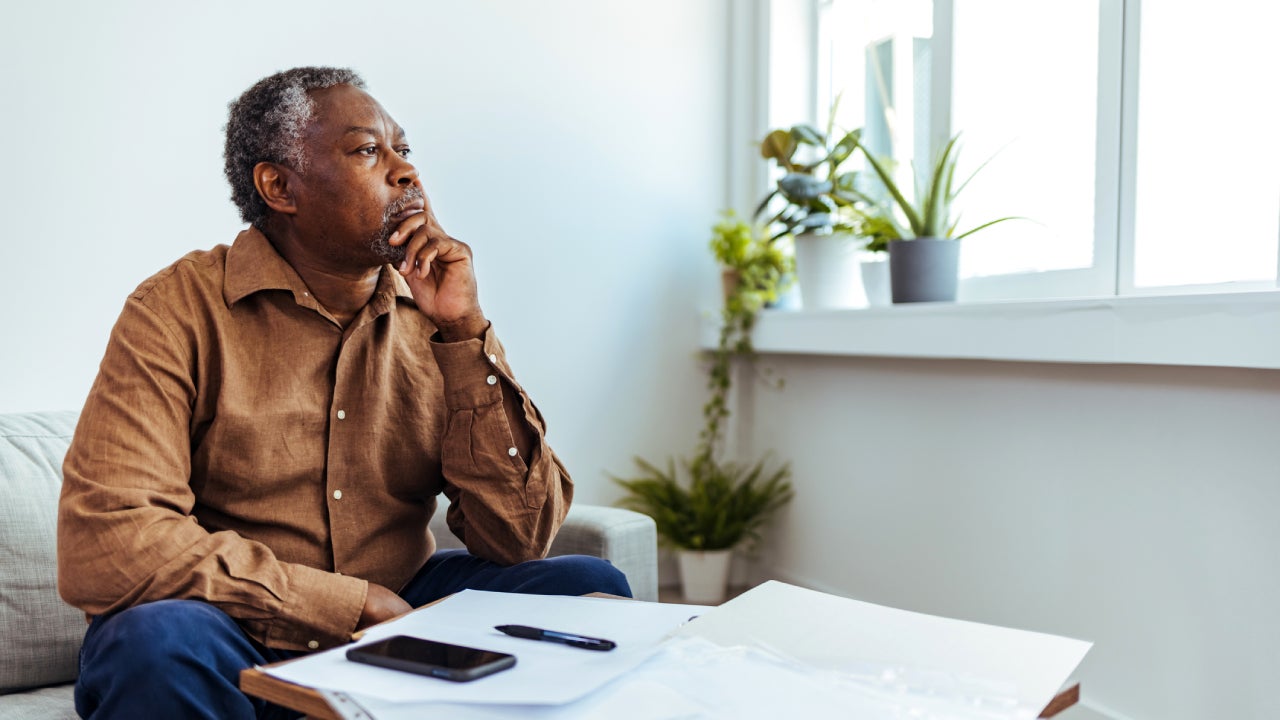 Mature businessman looking out of window