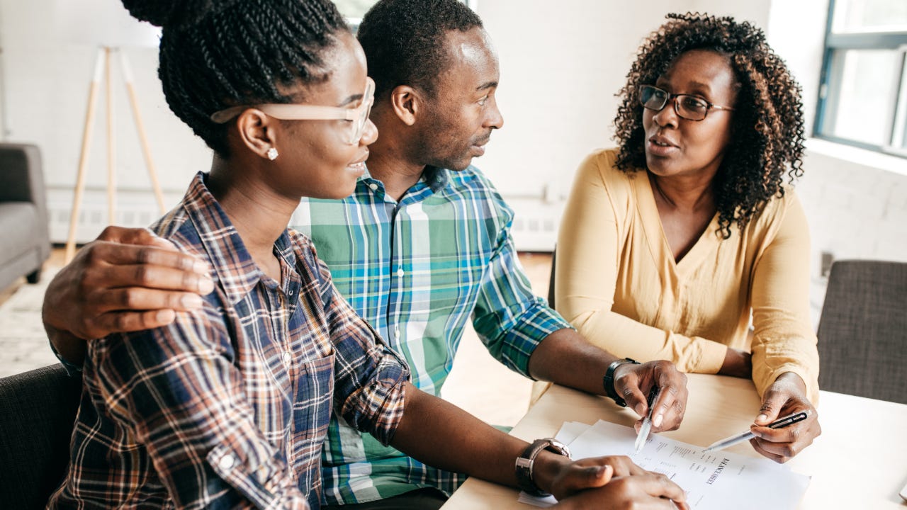 Couple working with a financial officer.