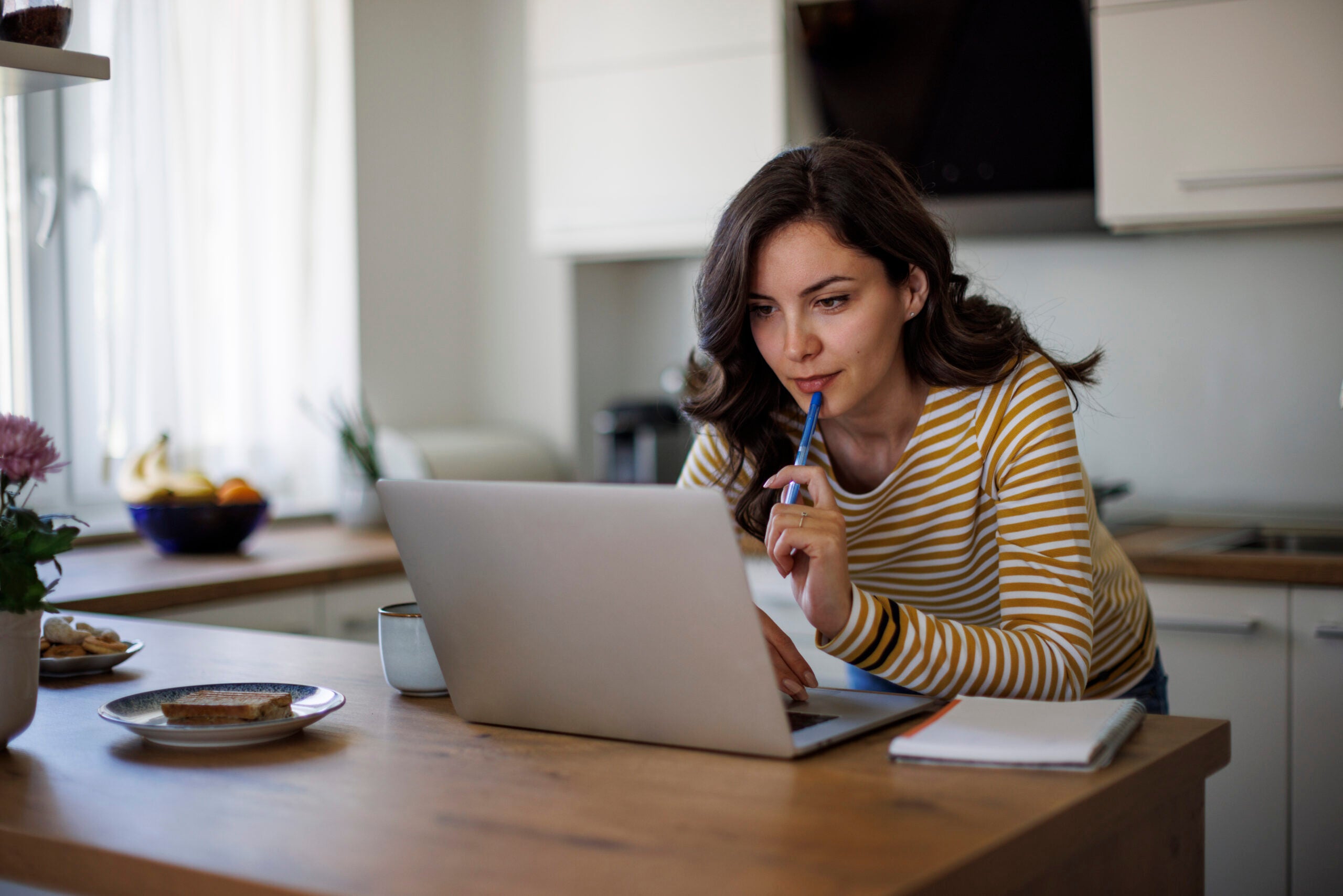 Young woman looking and comparing lenders online